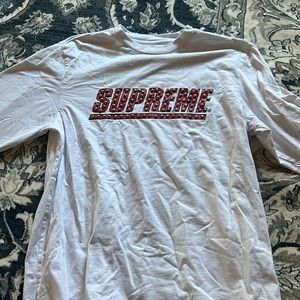 Supreme long sleeve white tshirt. Size medium. Small stain on arm as pictured.